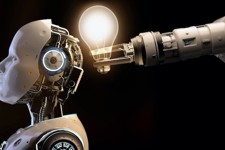 A robotic arm holding a lit bulb beside a humanoid robot's head